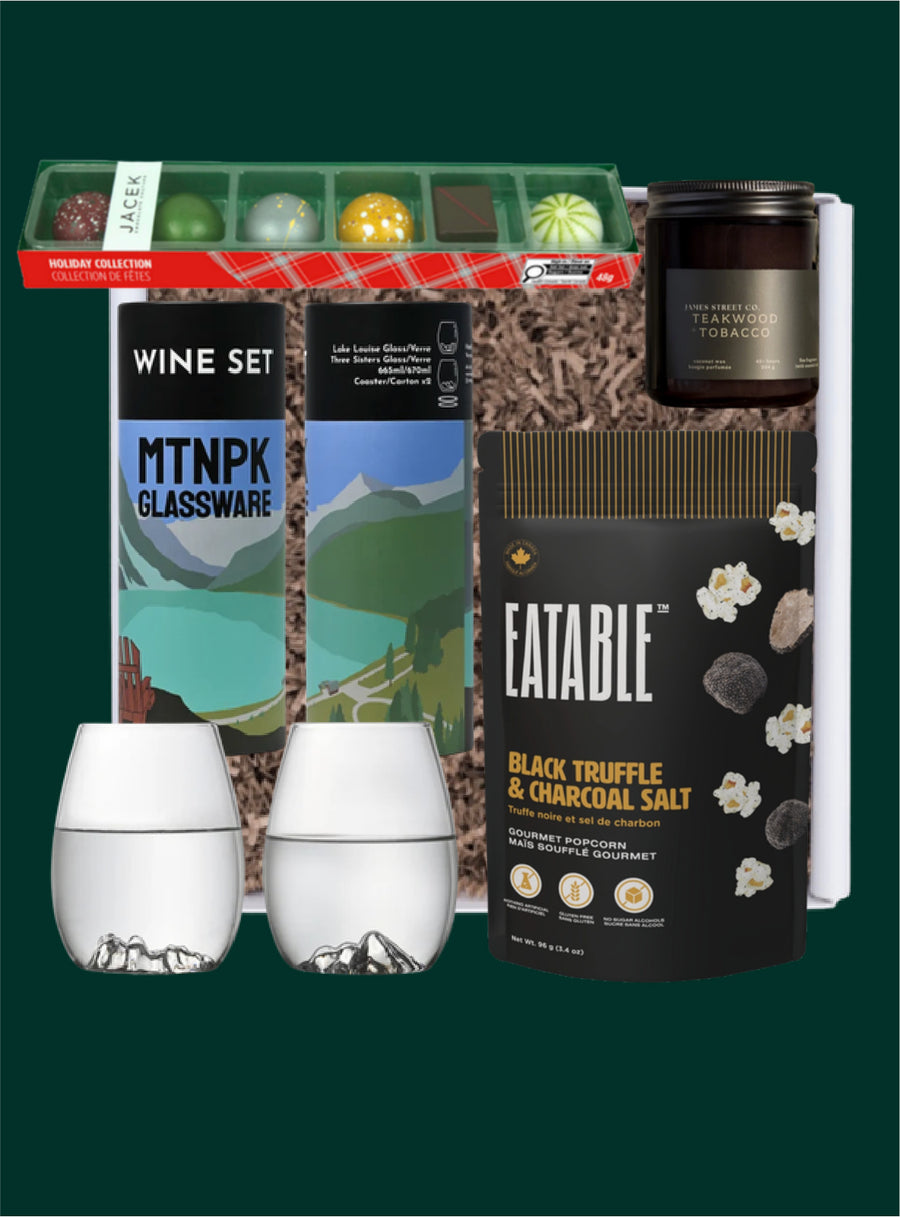 The Wine O'clock gift selection with MTNPK mountain wine glasses, JACEK truffles, a James Street Co. candle and Eatable popcorn.