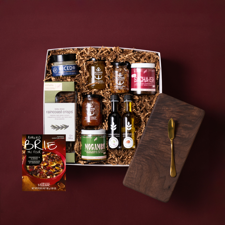 The Gourmet gift selection with a walnut board, gold butter knife, Evoolution oils, honey, savoury spreads, condiments and crisps.