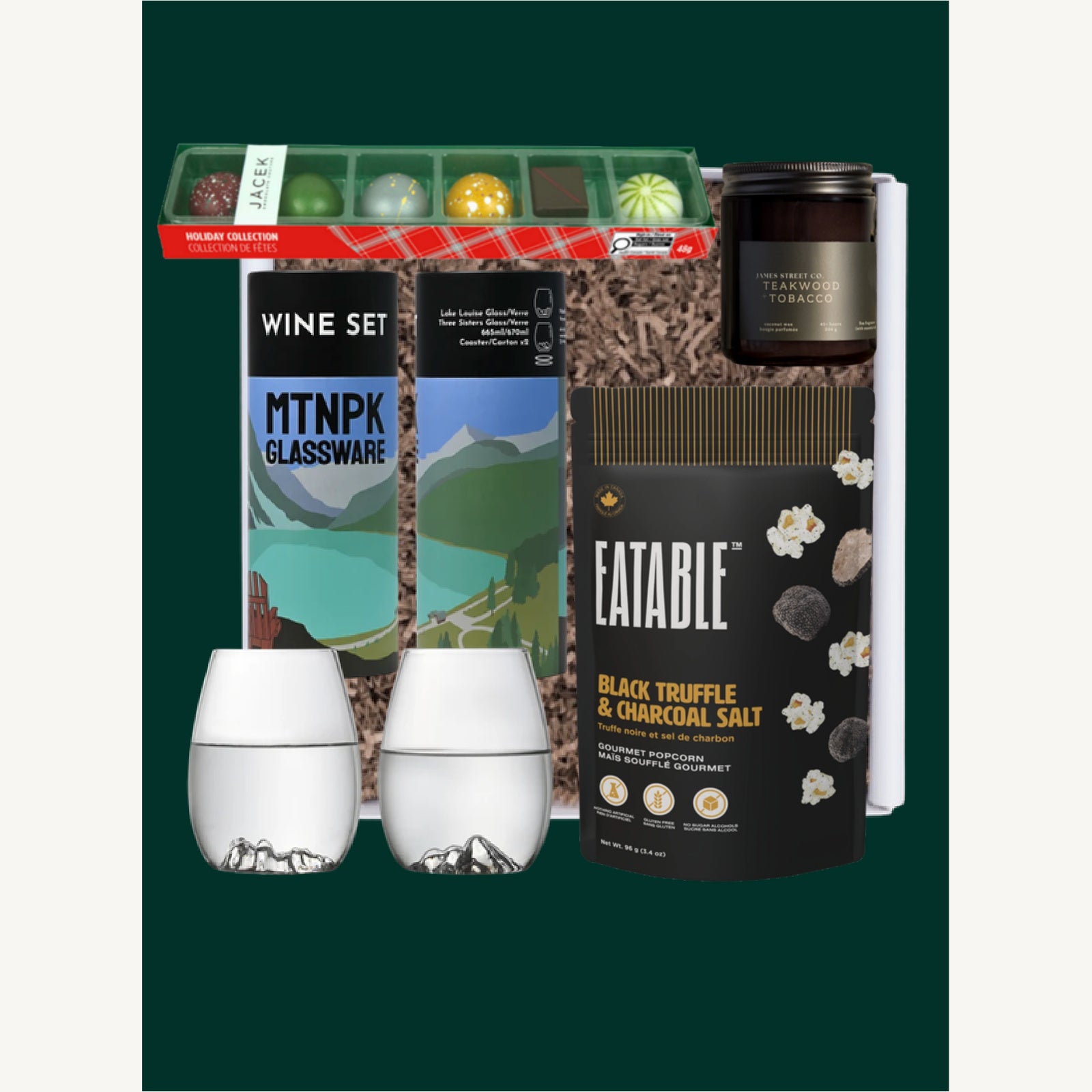 The Wine O'clock gift selection with MTNPK mountain wine glasses, JACEK truffles, a James Street Co. candle and Eatable popcorn.