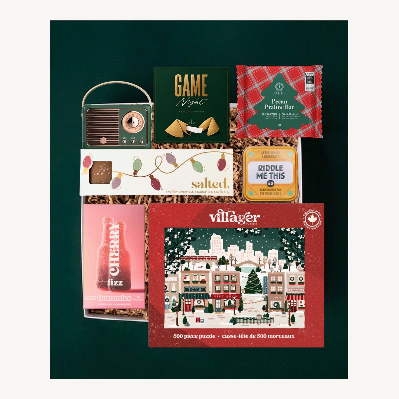 Game Night gift selection with a retro radio, Villager puzzle, riddles, JACEK chocolate, Salted caramels and Vesper Candy gummies.