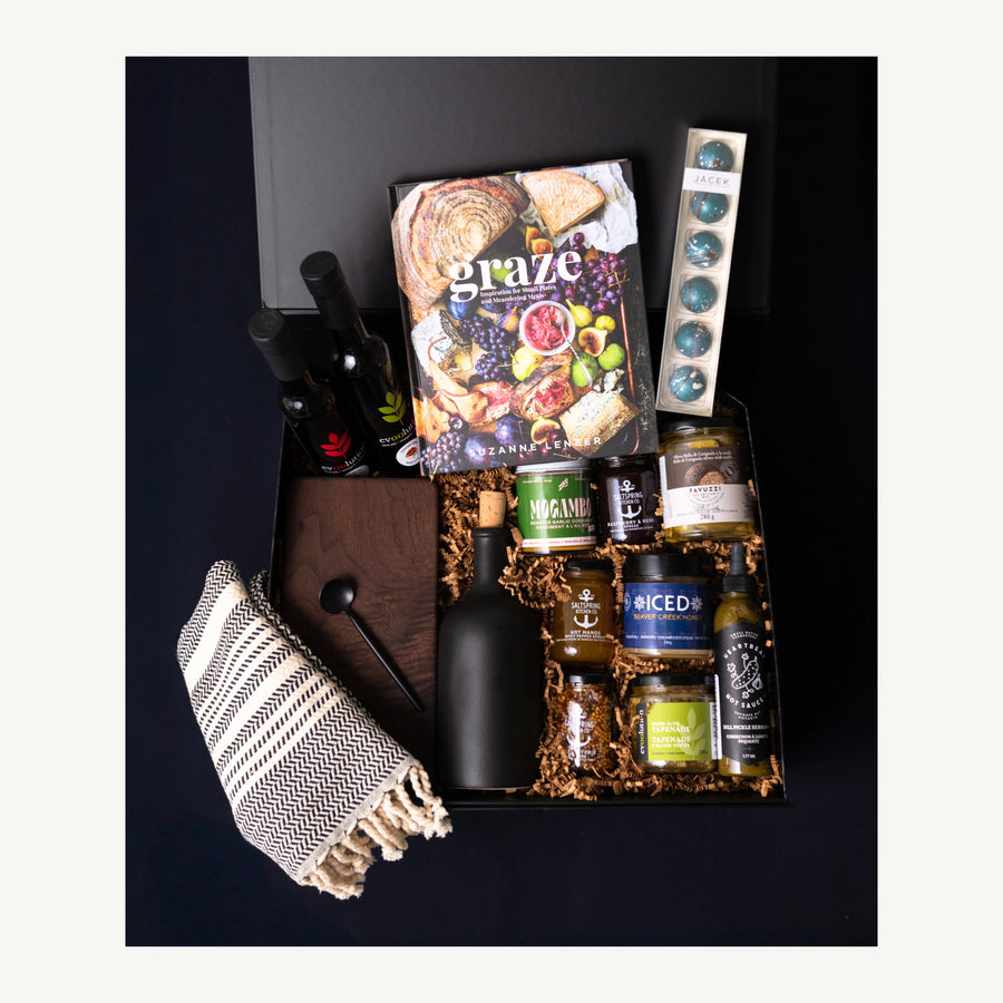 Gather & Graze gourmet gift selection with a walnut board, Graze recipe book, ceramic oil bottle, honey and pantry favourites.