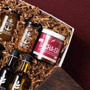 Salt Spring Kitchen Co. spreads, mustard and Zing chili miso condiment beside Evoolution oils.