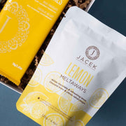 JACEK Lemon Meltaways beside a JACEK chocolate bar in The Park gift box.