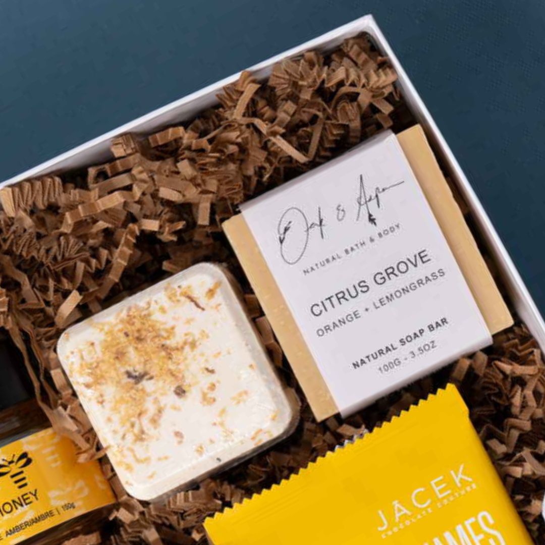 Oak & Aspen Citrus Grove natural soap bar beside a lemon shower steamer.