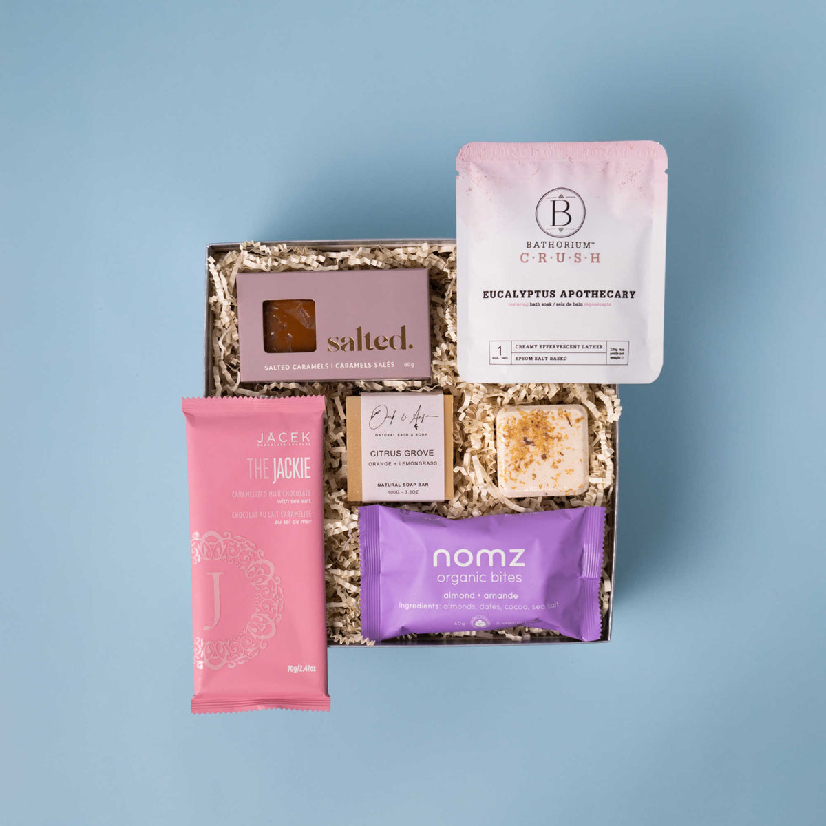 The Zen gift box with Bathorium bath soak, JACEK chocolate, Salted caramels, Oak & Aspen soap, a shower steamer and Nomz bites.