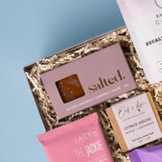 Salted caramels beside Bathorium Eucalyptus Apothecary bath soak and Oak & Aspen soap.